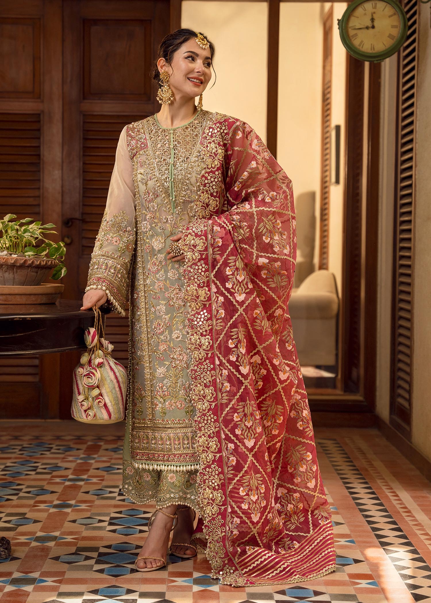 Artisanal Anecdotes Pakistani fashion outfit in gold, pink tones.
